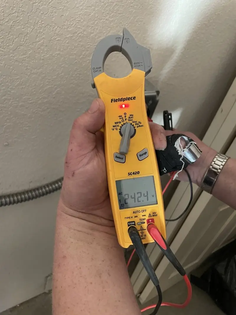 Voltage testing with clamp meter during Outlet Installation in Portsmouth